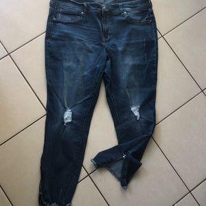 Comfortable stretchy jeans. Side zippers, 3/4 length style, worn ripped look.